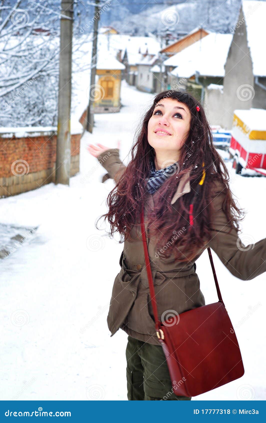 Woman walking outside in winter time. Beautiful young woman walking outside enjoying in winter time