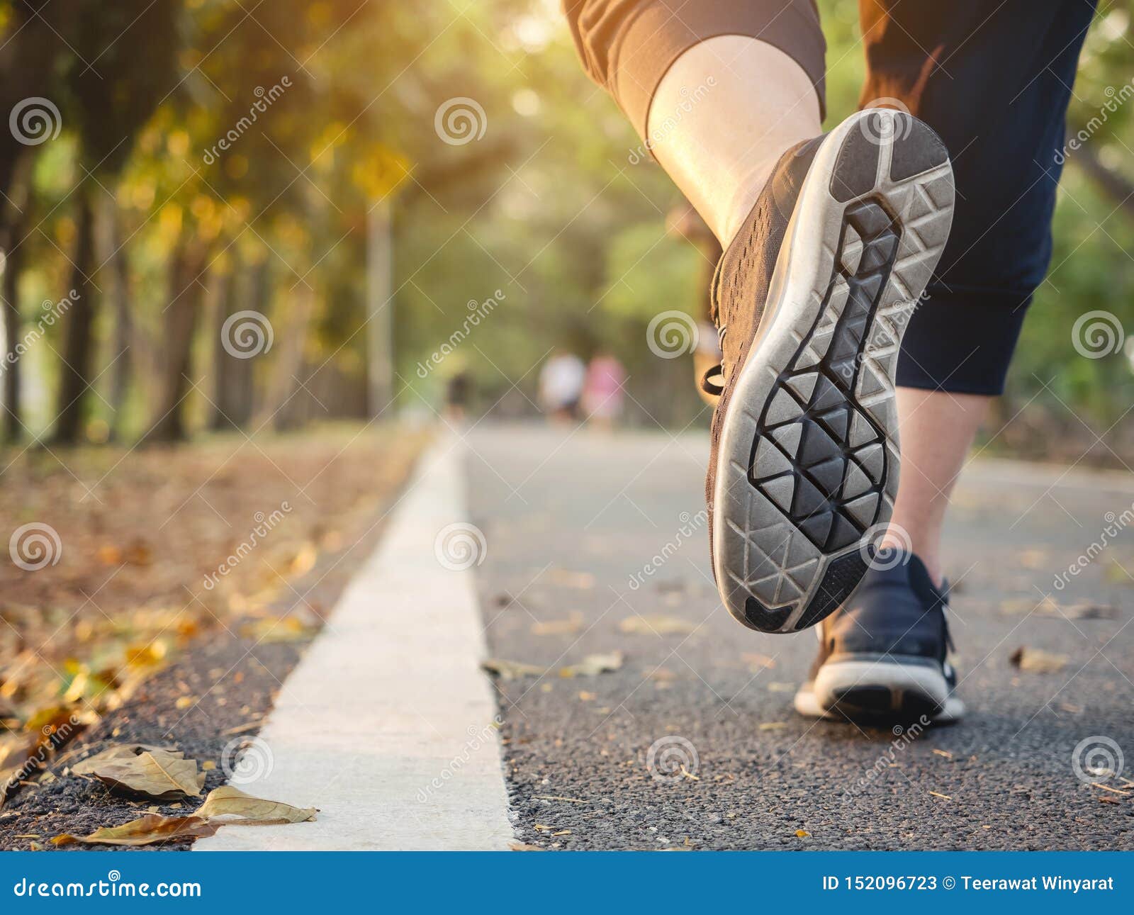 woman walking in park outdoor workout trail exercise healthy lifestyle