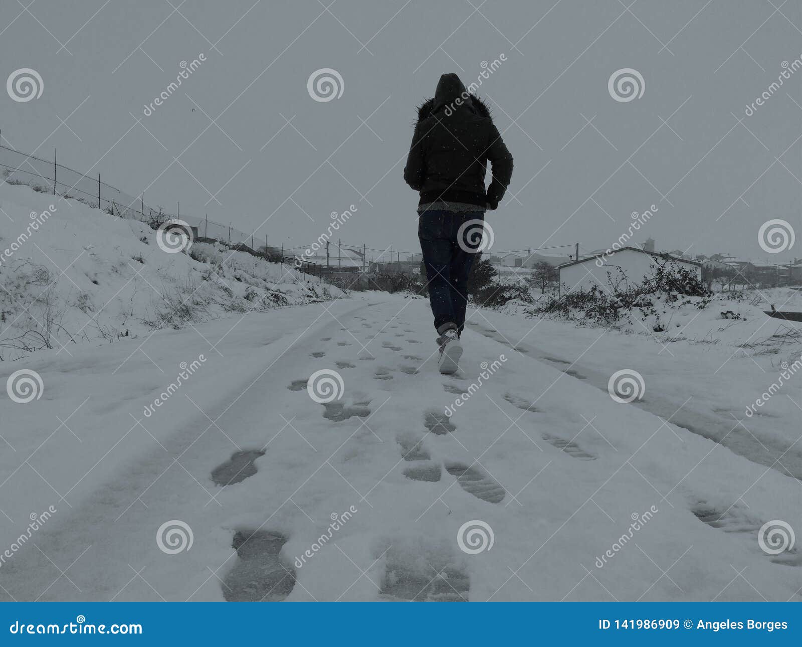 a woman walking through the snow