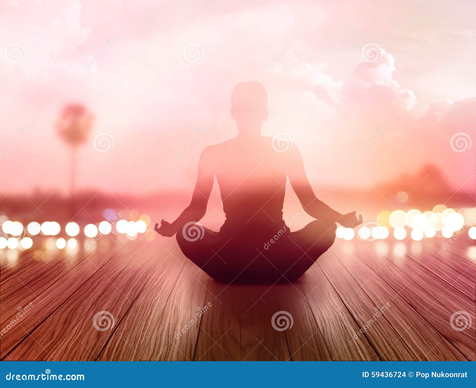 woman was meditating in sunrise and rays of light on landscape