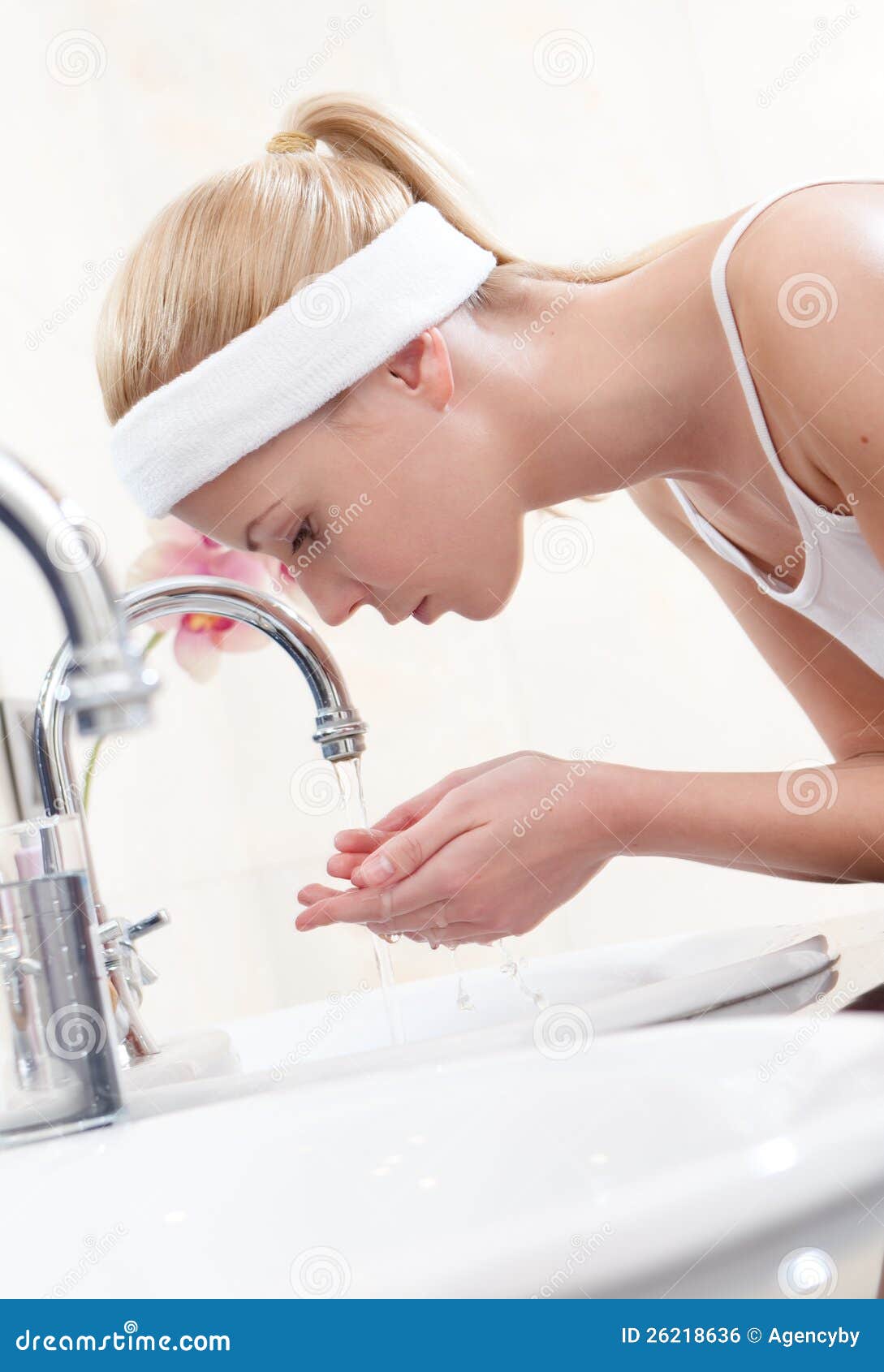Woman washes her face stock photo. Image of hair, long 26218636