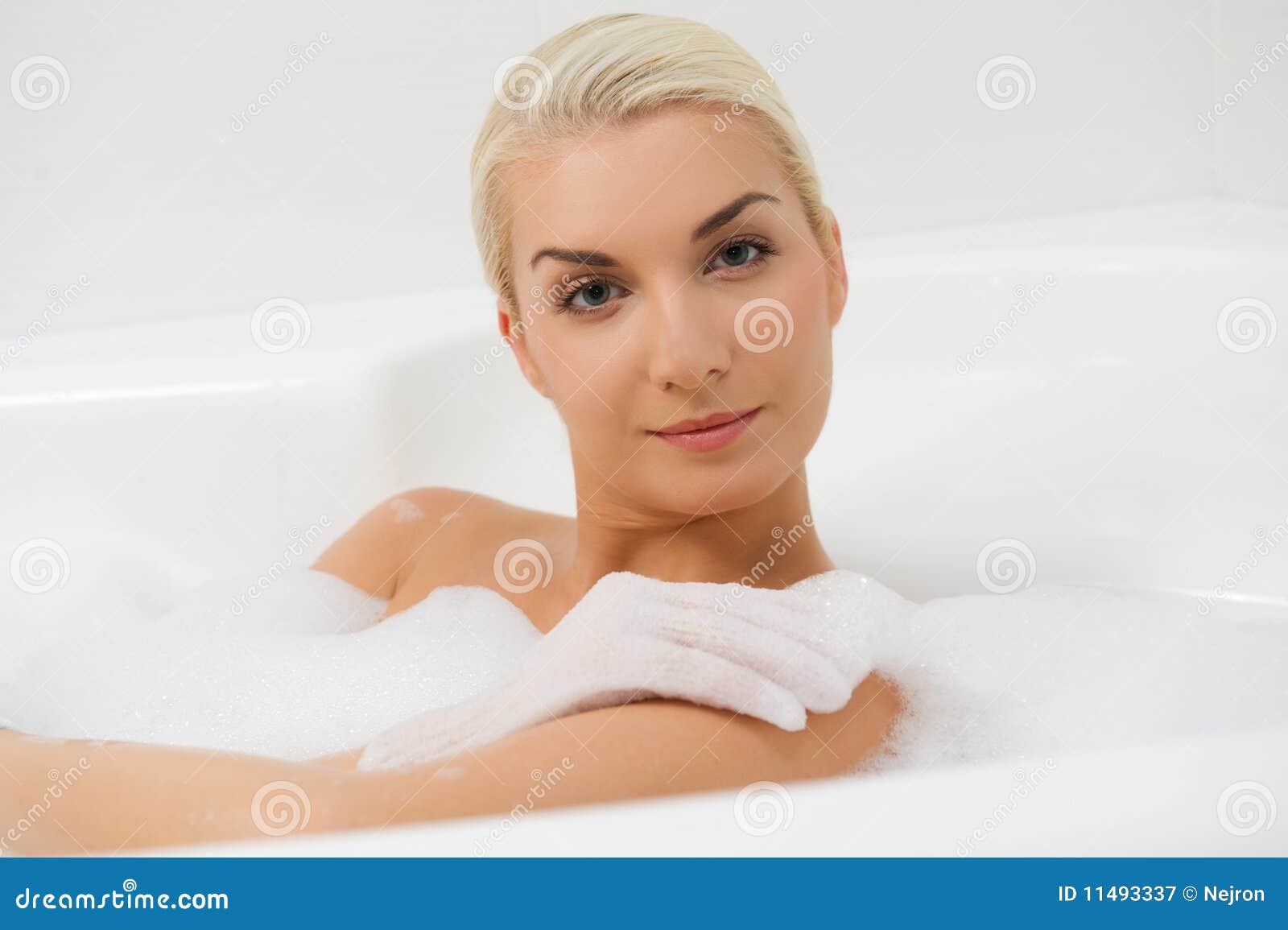Woman washing in bathroom stock image. Image of scrub 11493337