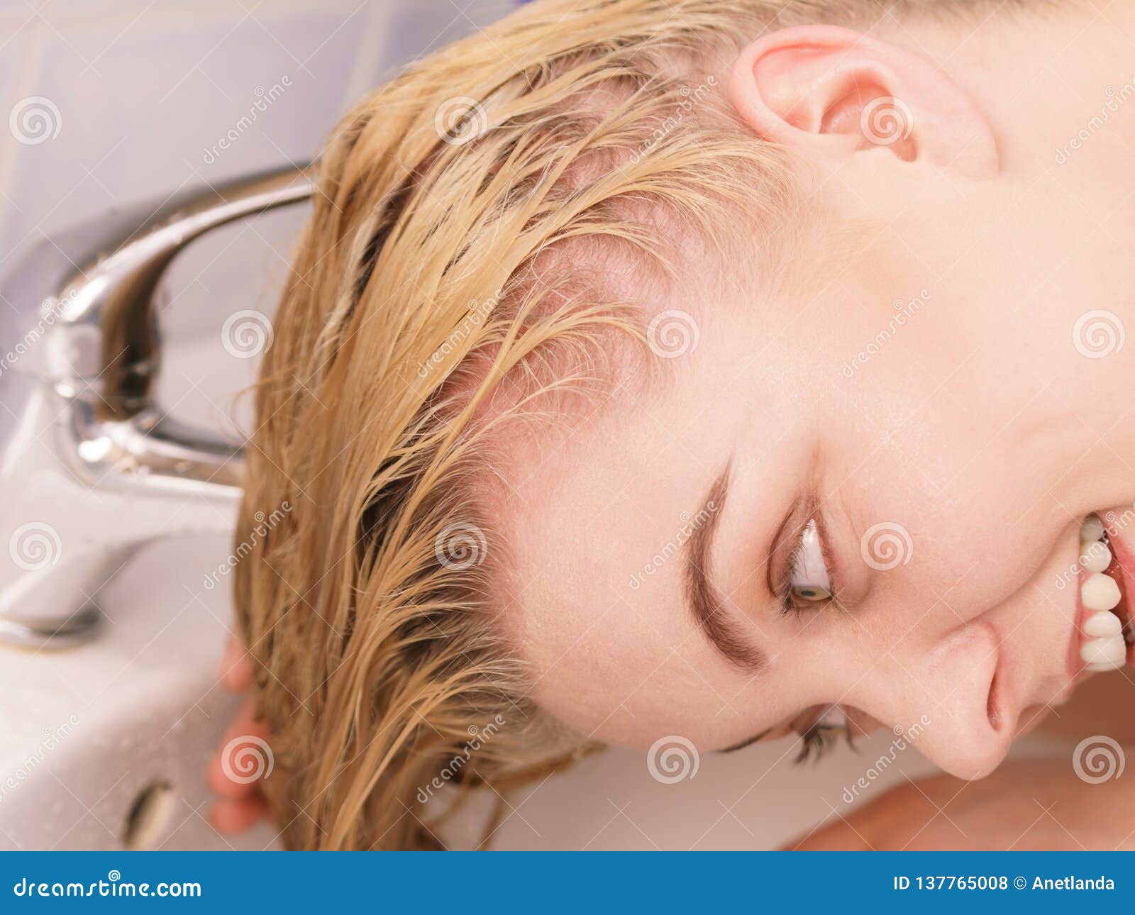 washing hair in bathroom sink