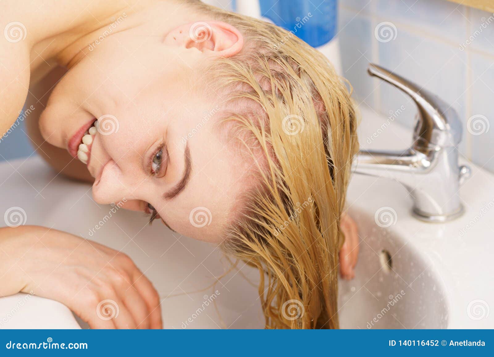 washing hair in bathroom sink