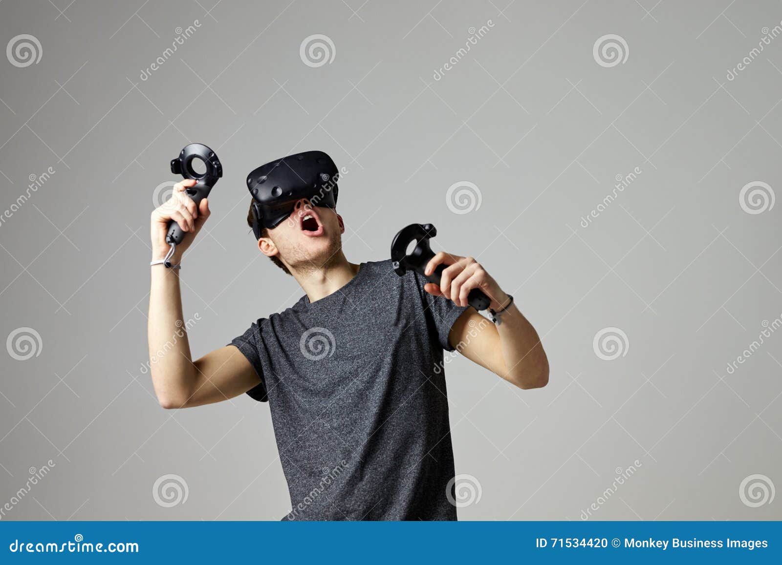 Woman Watching Television Wearing Virtual Reality Headset Stock Photo