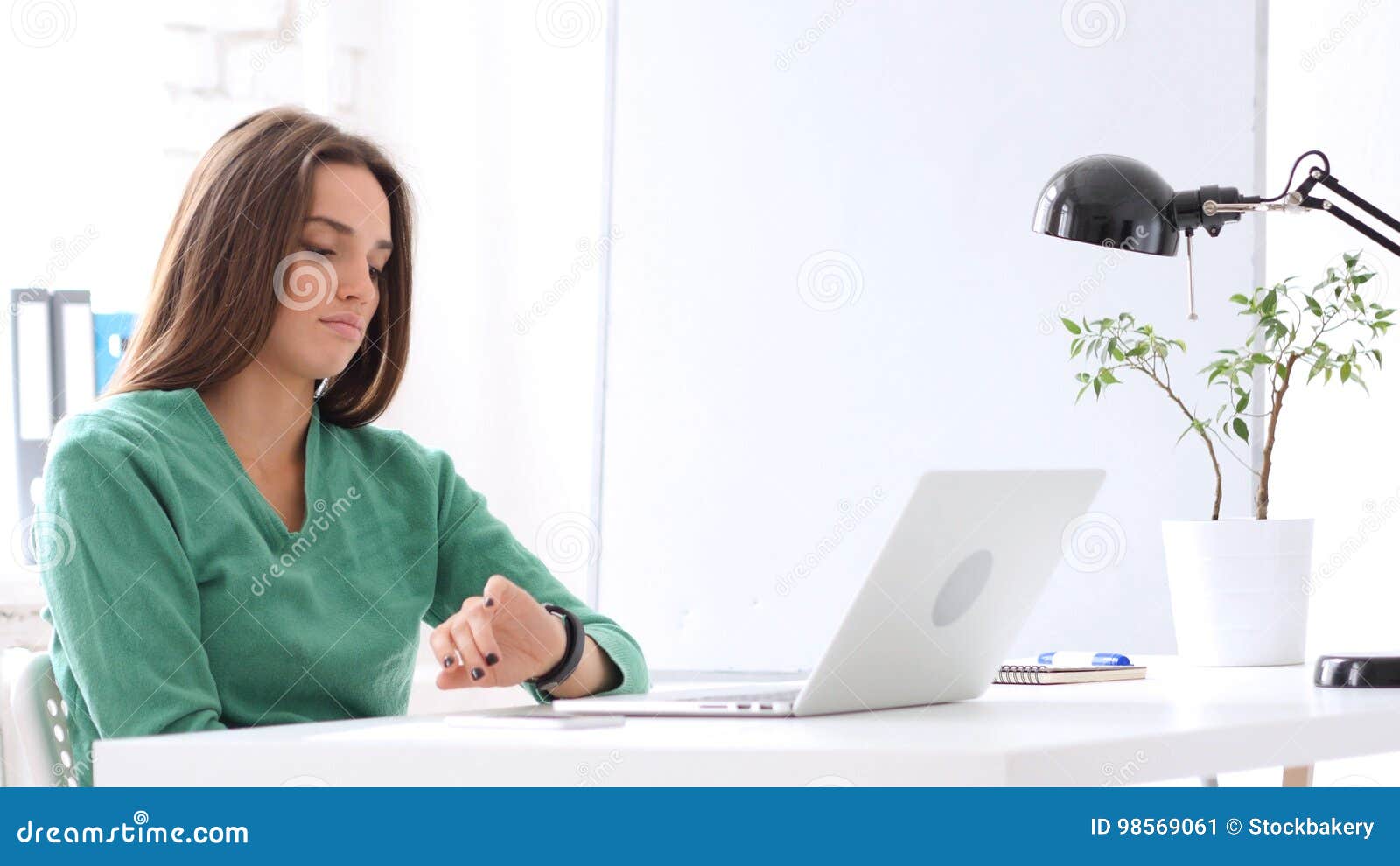 Woman Watching Time on Watch while Waiting in Office Stock Image ...
