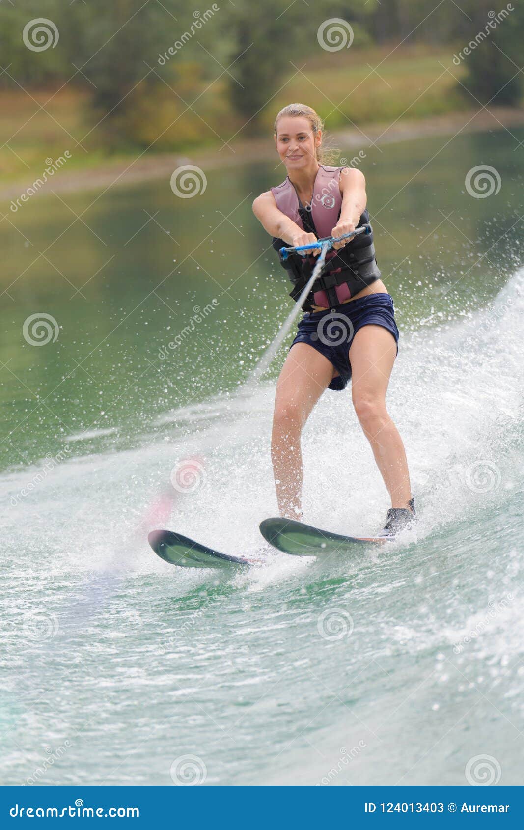 Woman on water skis stock image. Image of horizon, people 124013403
