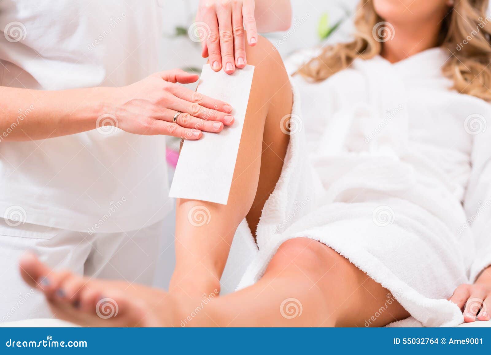 woman at waxing hair removal in beauty parlor