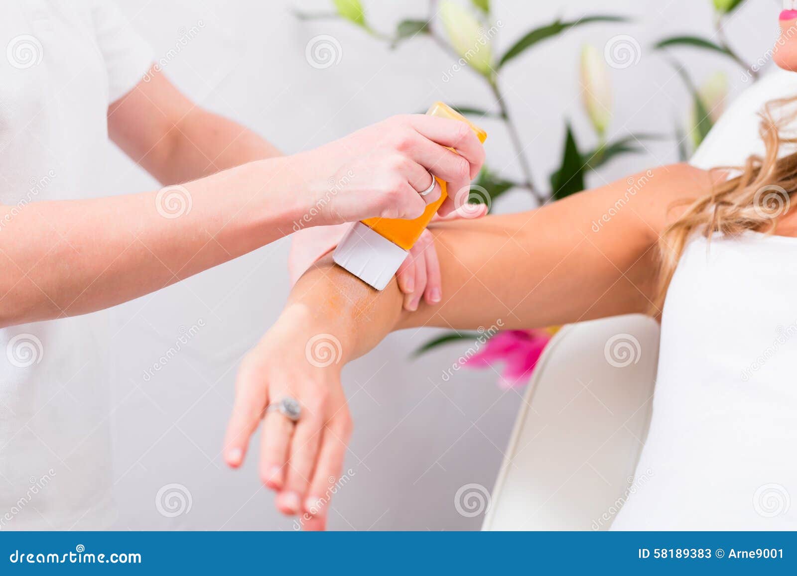 woman at waxing hair removal in beauty parlor