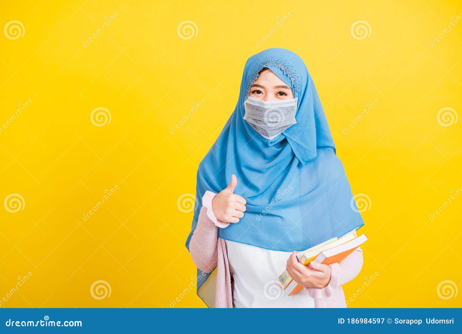 Woman Wear Hijab  And Face Mask  Protective Hold Books On 