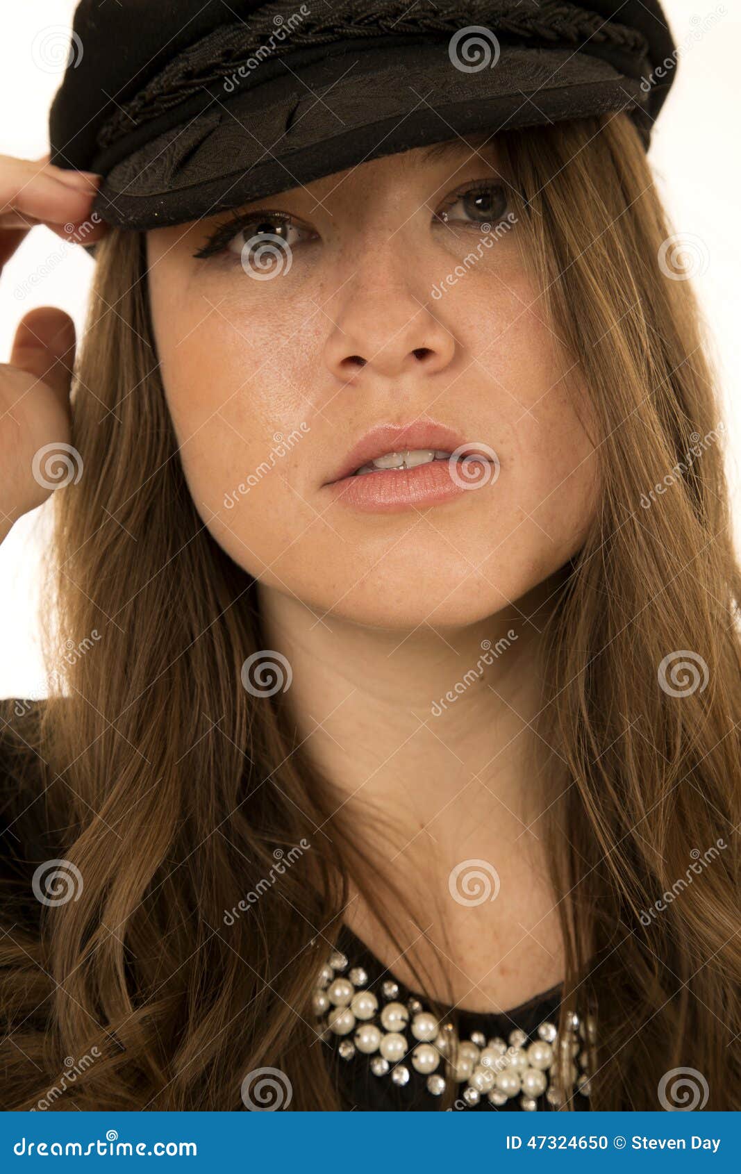 Woman Wearing Black Hat Looking at Camera Somber Look Stock Photo ...