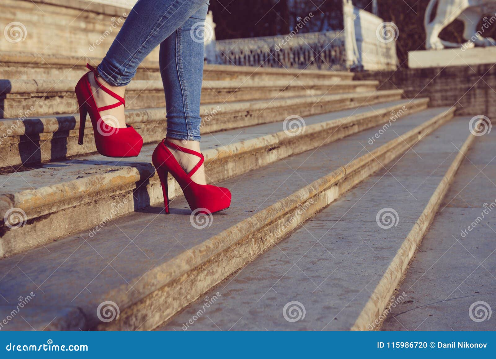 Woman Wearing Blue Jeans and Red High Heel Shoes in Old Town. the Women ...