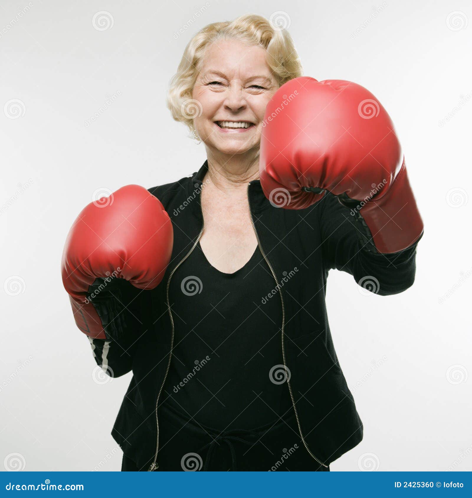 Woman Wearing Boxing Gloves. Stock Photo Image of indoors, looking