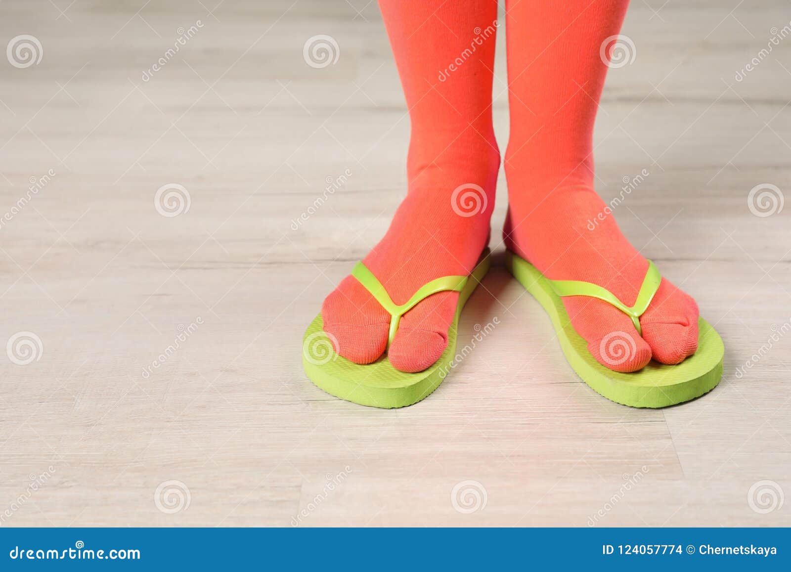 Woman Wearing Bright Socks with Flip-flops Standing on Floor Stock ...