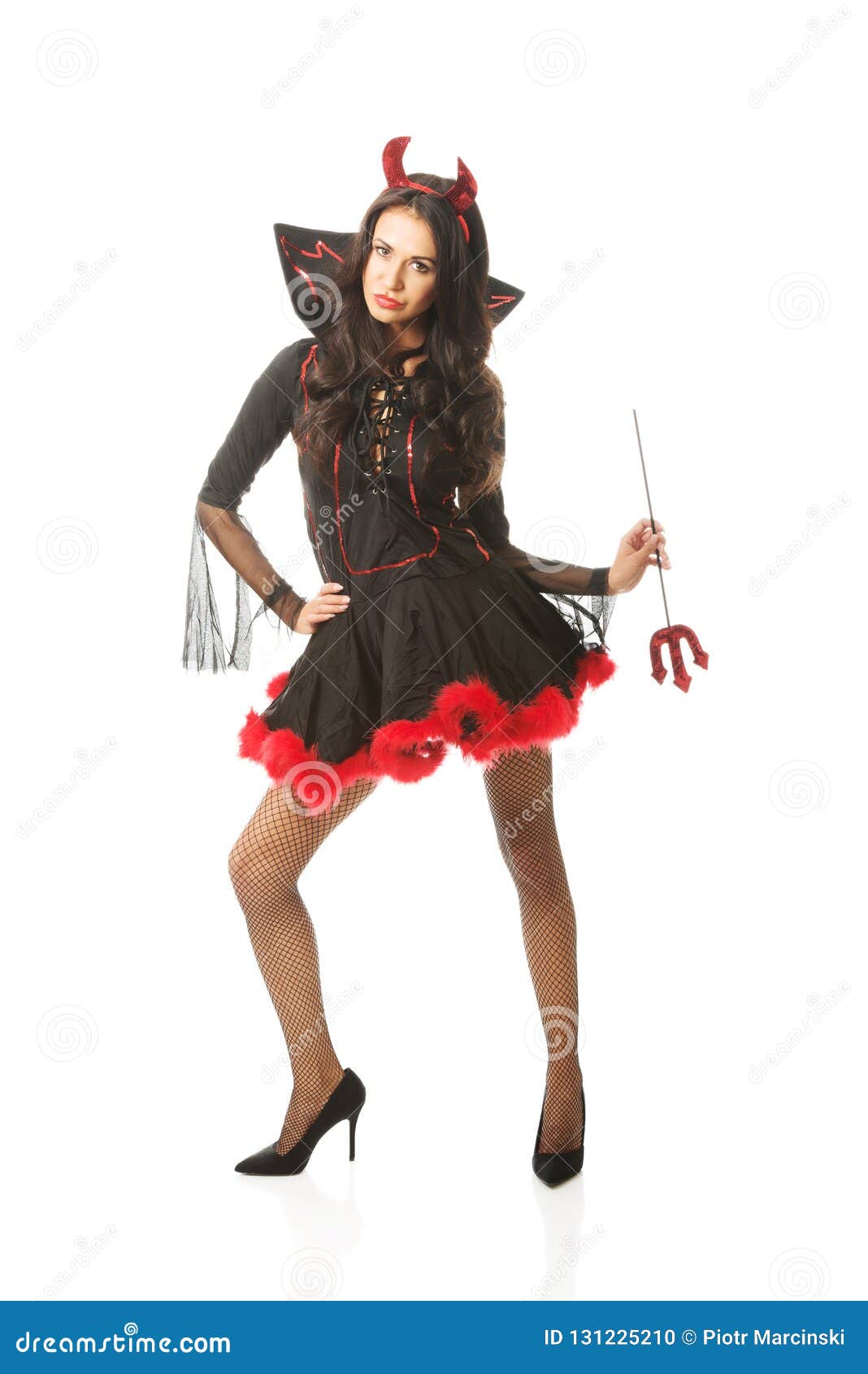 Woman Wearing Devil Clothes, Standin Astride, Holding Trident Stock ...