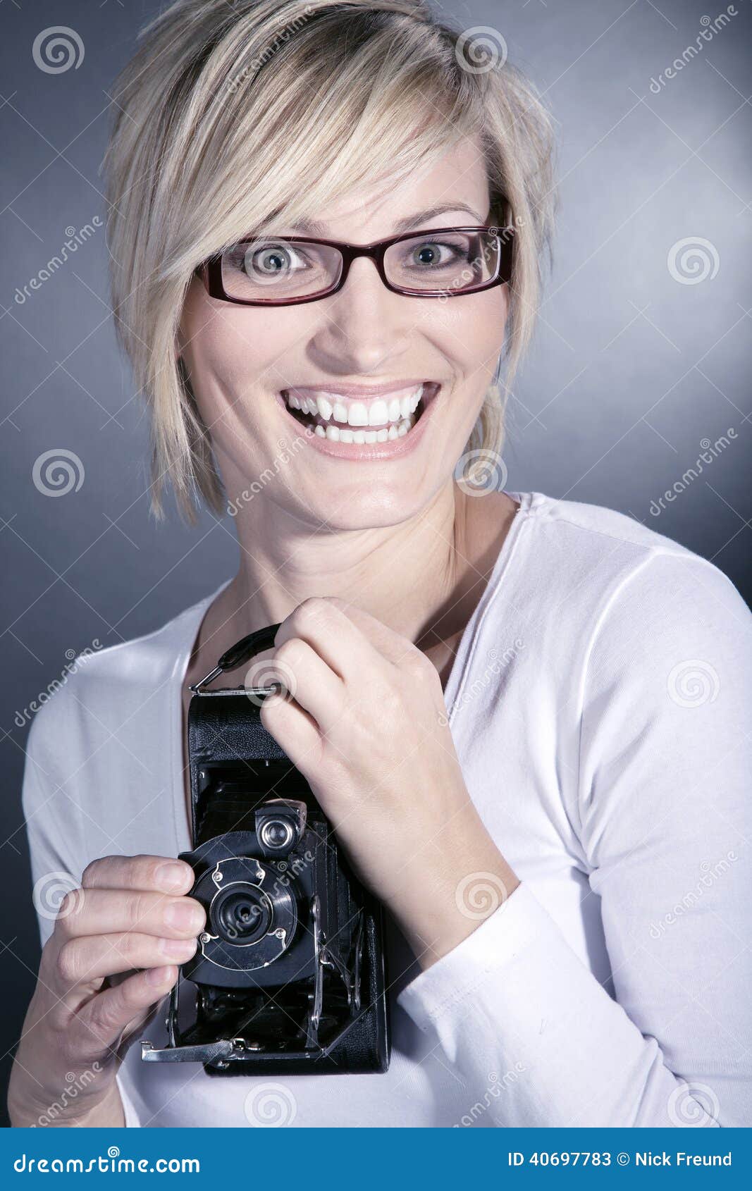 Woman Wearing Glasses With Old Retro Camera Stock Image