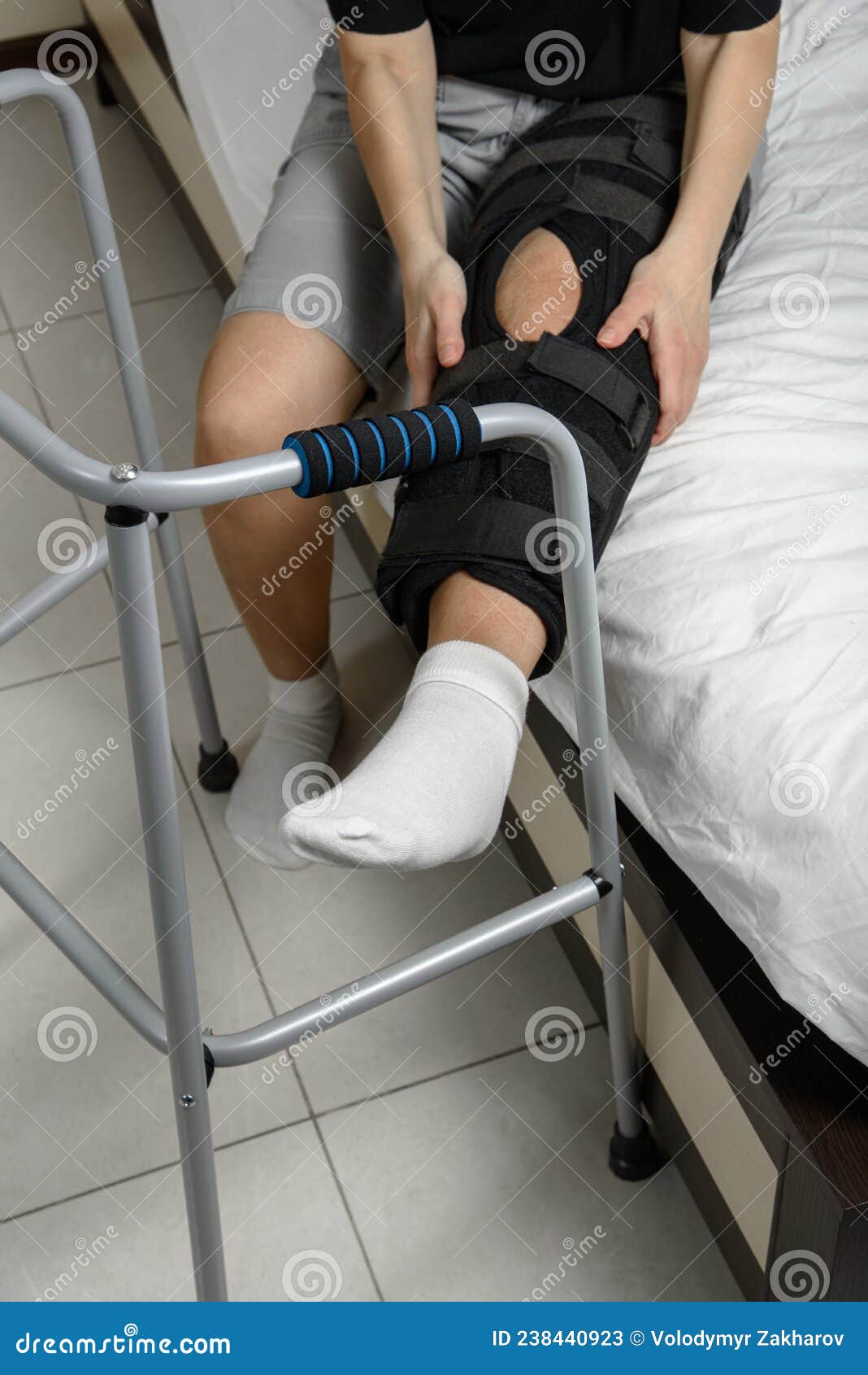 Woman Wearing Knee Brace after Leg Fracture Sitting on Bed Trying To Get Up  with Walker. Recovery after Surgery Stock Image - Image of install, plate:  238440923