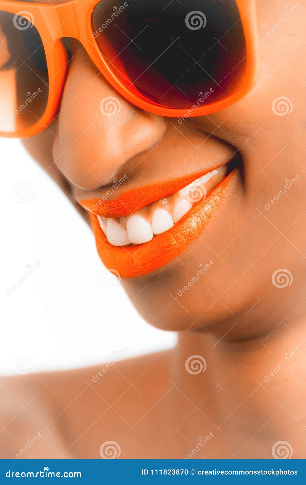 Woman Wearing Orange Frame Sunglasses And Orange Lipstick Picture
