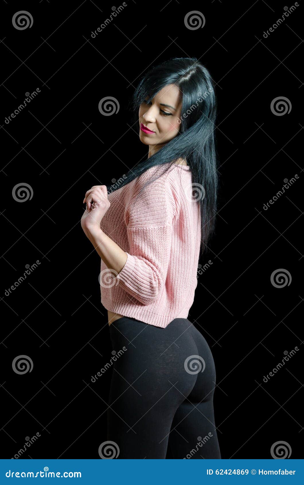 Full length colour studio portrait female wearing pink shirt and black  leggings on grey neutral background, hand placed on head Stock Photo - Alamy