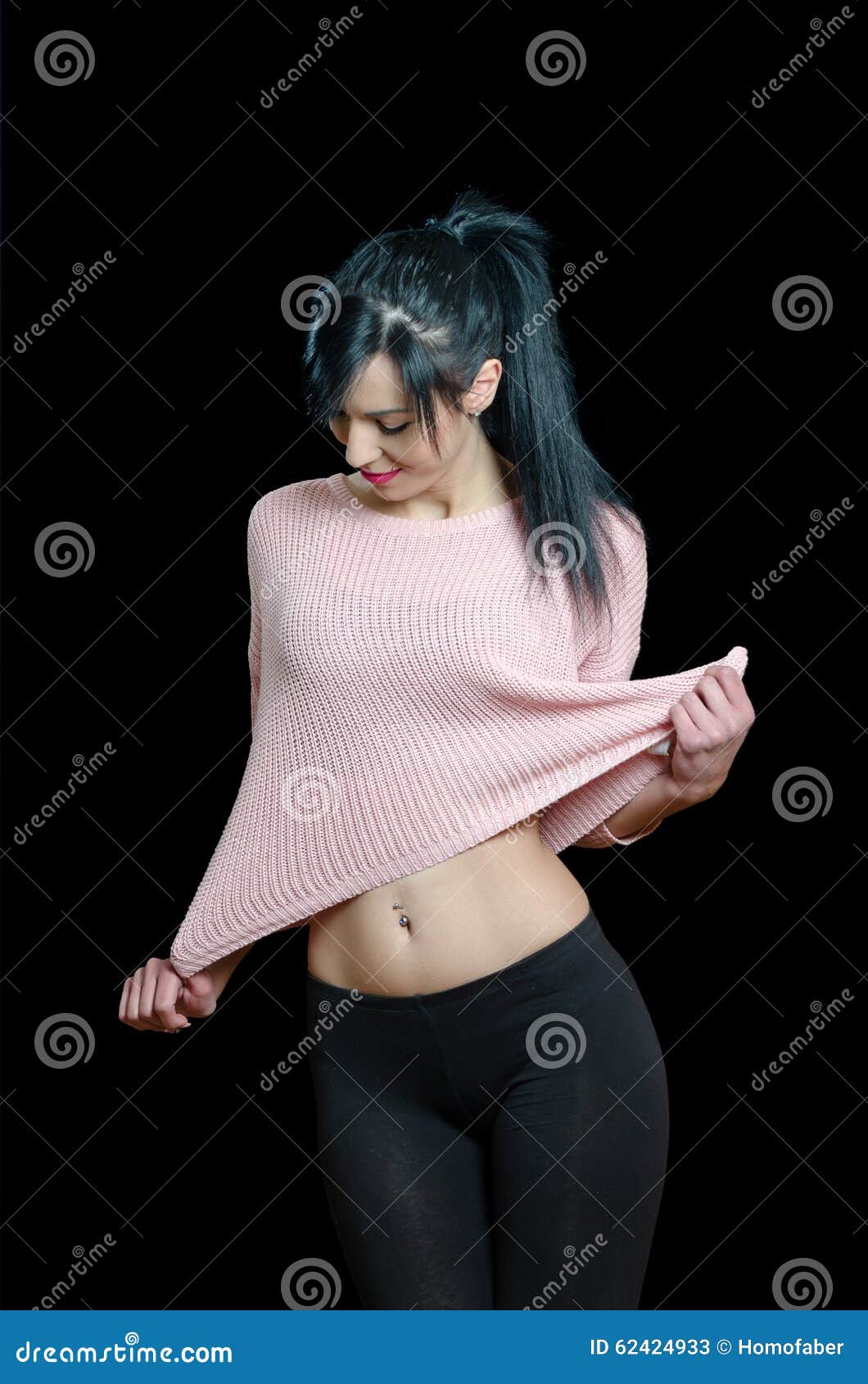 Full length colour studio portrait female wearing pink shirt and black  leggings on grey neutral background, hand placed on head Stock Photo - Alamy