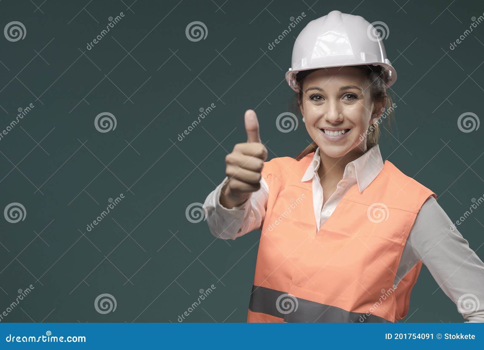 woman wearing protective workwear and safety helmet