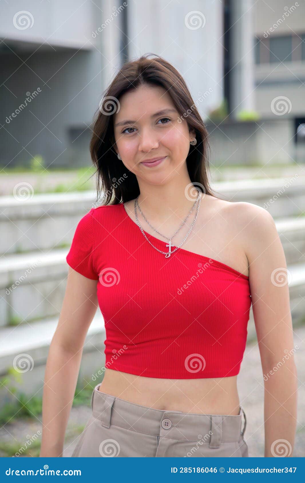 Woman Wearing a Red Top Camisole in the City during Summer Stock