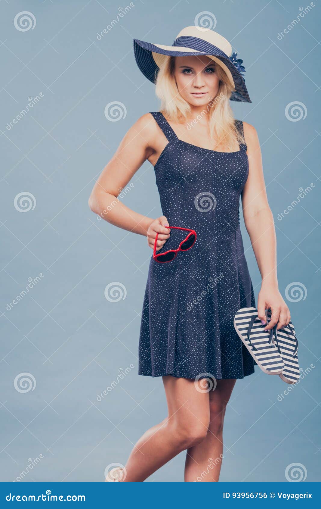Woman Wearing Short Dress Holding Flip Flops and Sunglasses Stock Photo ...