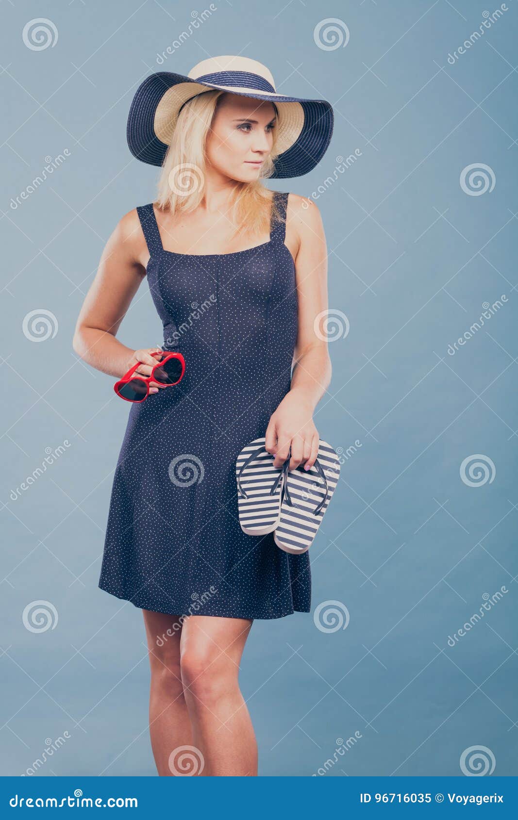 Woman Wearing Short Dress Holding Flip Flops and Sunglasses Stock Image ...