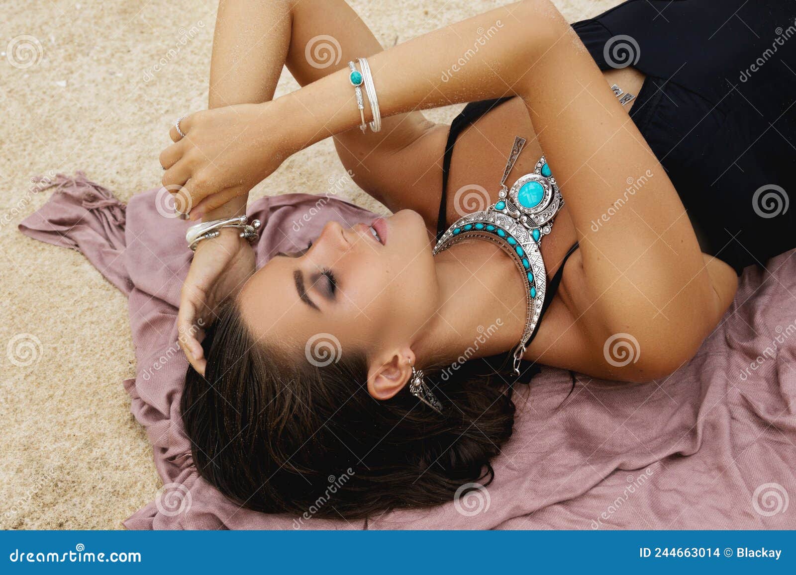 Woman Wearing Silver Jewelry on the Beach Stock Photo