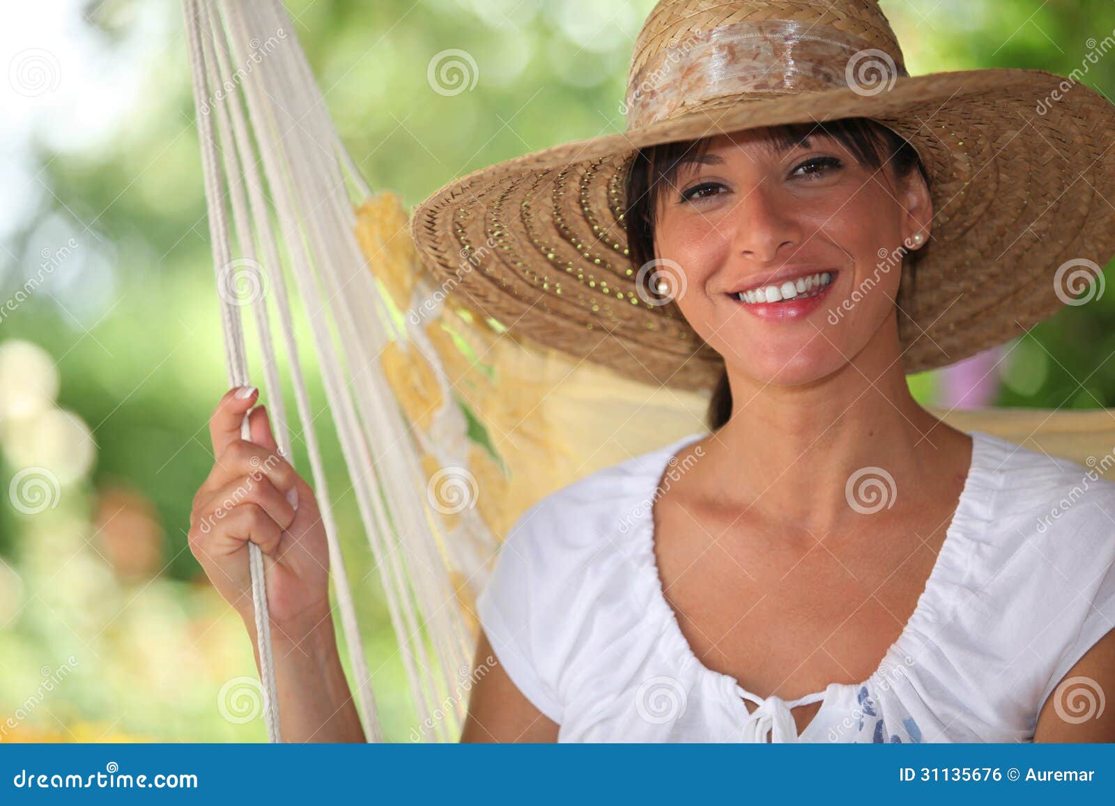 Woman wearing a straw hat stock photo. Image of blissful 31135676