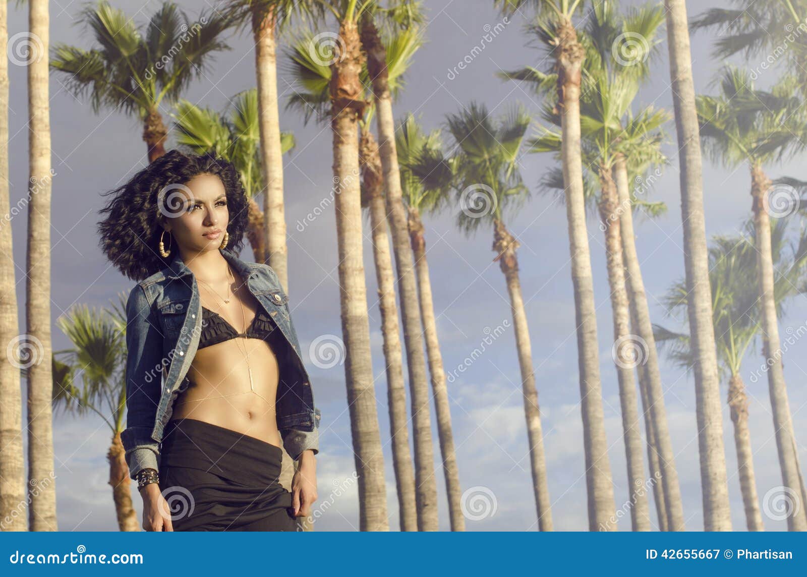 woman wearing swimwear epic palm tree background.