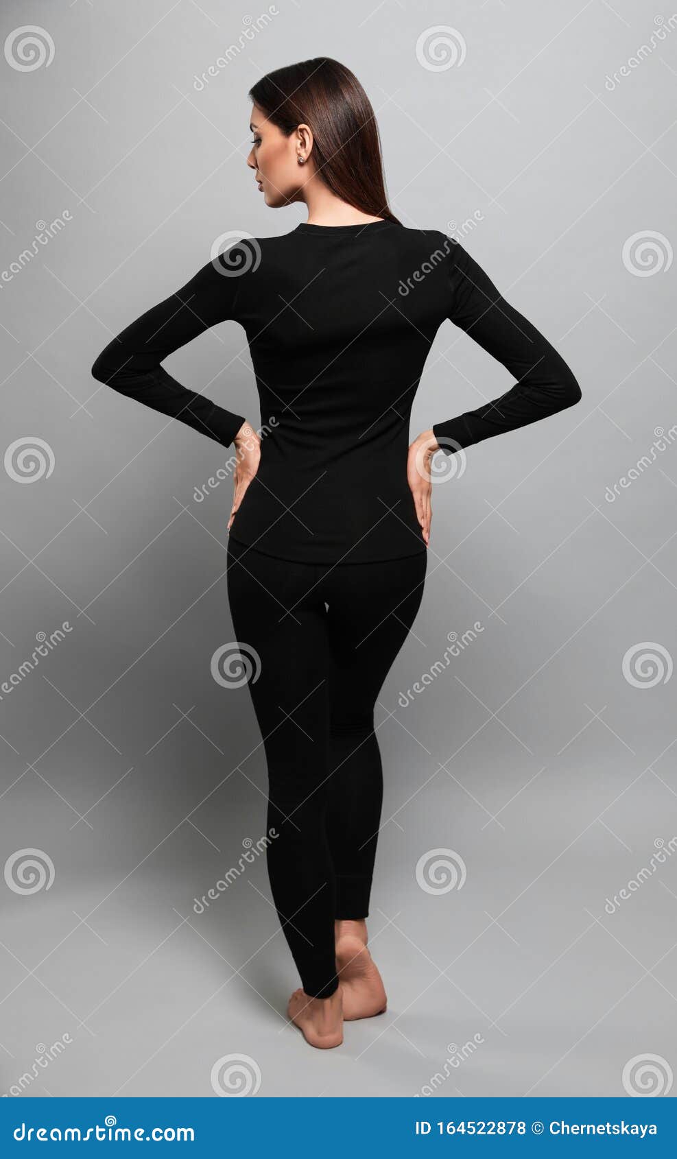 Download Woman Wearing Thermal Underwear On Grey, Back View Stock ...