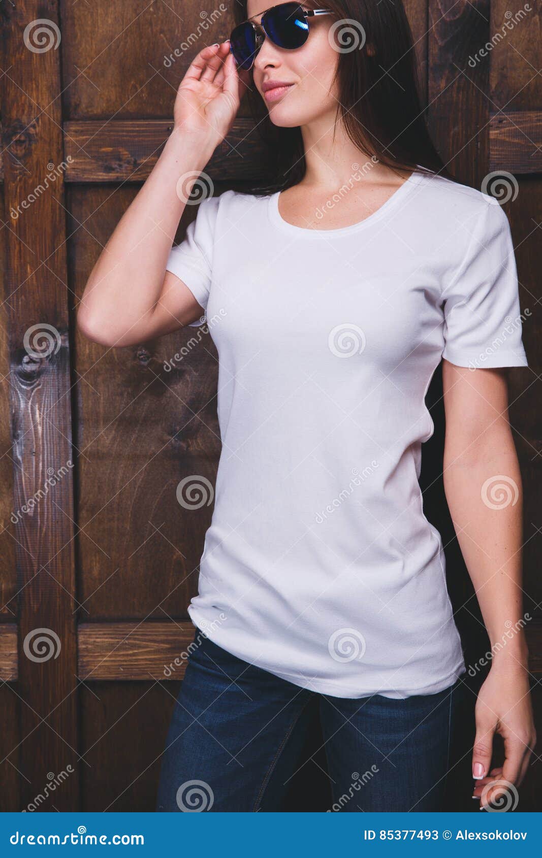 Download Woman Wearing White T-shirt In Front Of Wooden Wall Stock ...