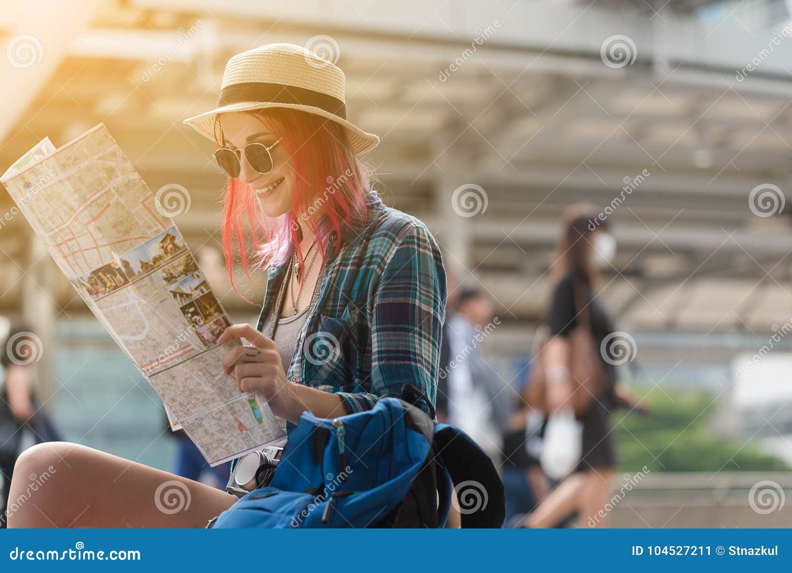 woman westerner looking at map during city tour in the morning,