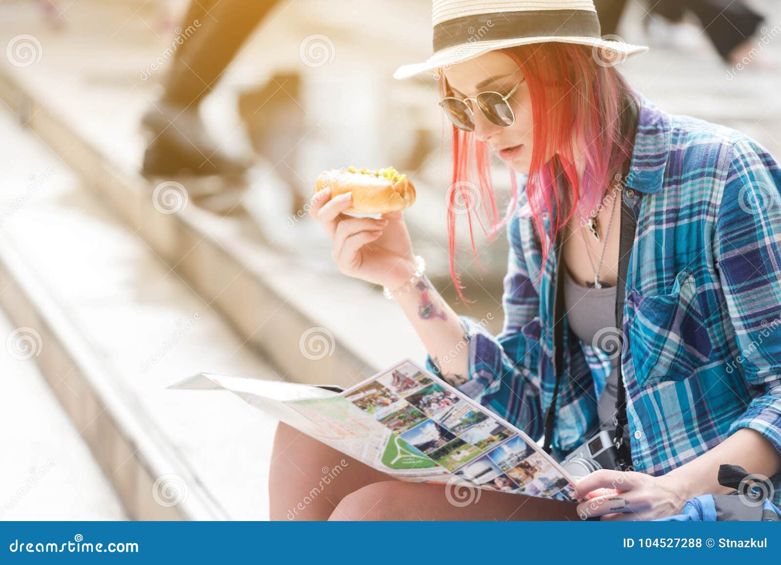woman westerner looking at map and smartphone during breakfast w