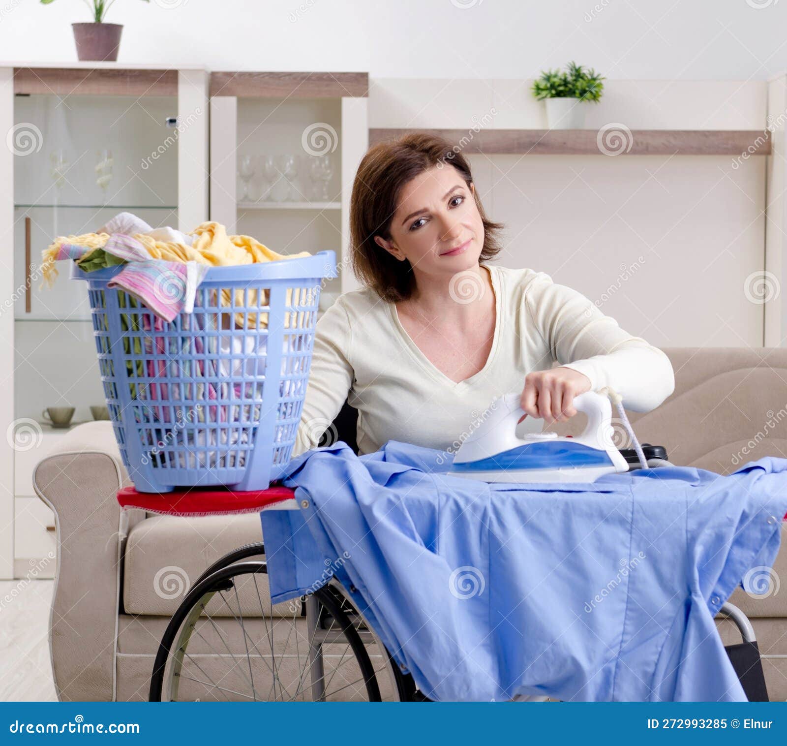 Woman in Wheelchair Ironing at Home Stock Image Image of injury, housekeeping 272993285