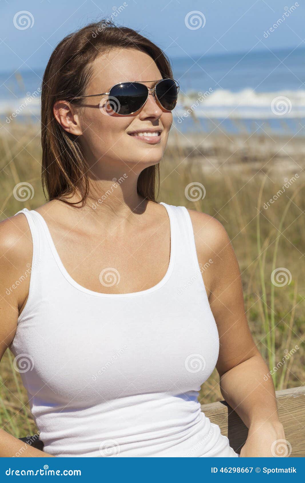 Woman In White Dress And Sunglasses At Beach Stock Image