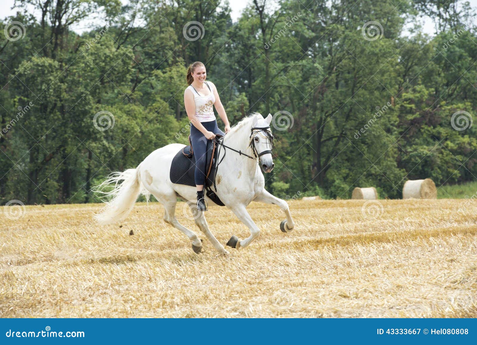 woman on white horseback on stubblefield