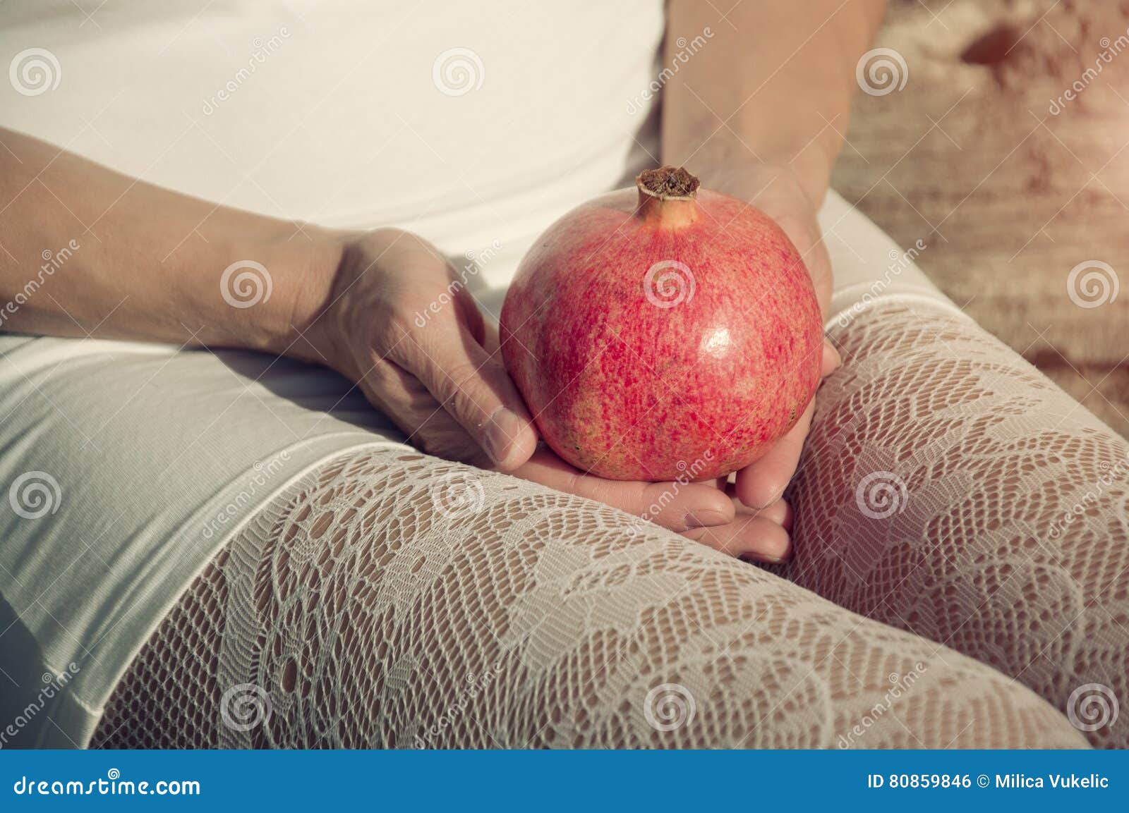 Woman In White Lace Stockings Holding Pomegrante Stock