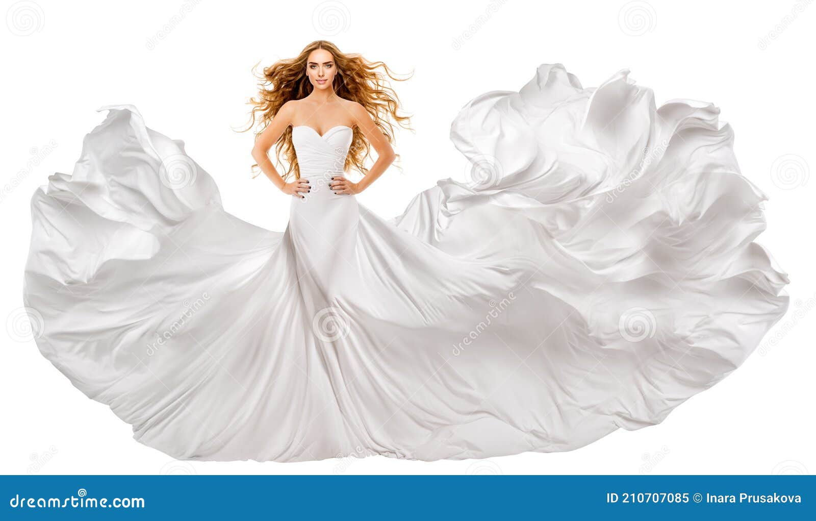 woman white long dress. red hair model in wedding gown. white silk fabric waving on wind. curly redhead flying hairstyle. 