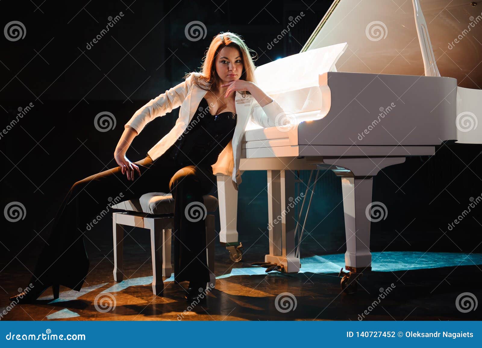 The Woman With White Piano Beautiful Pianist On The Stage Near The