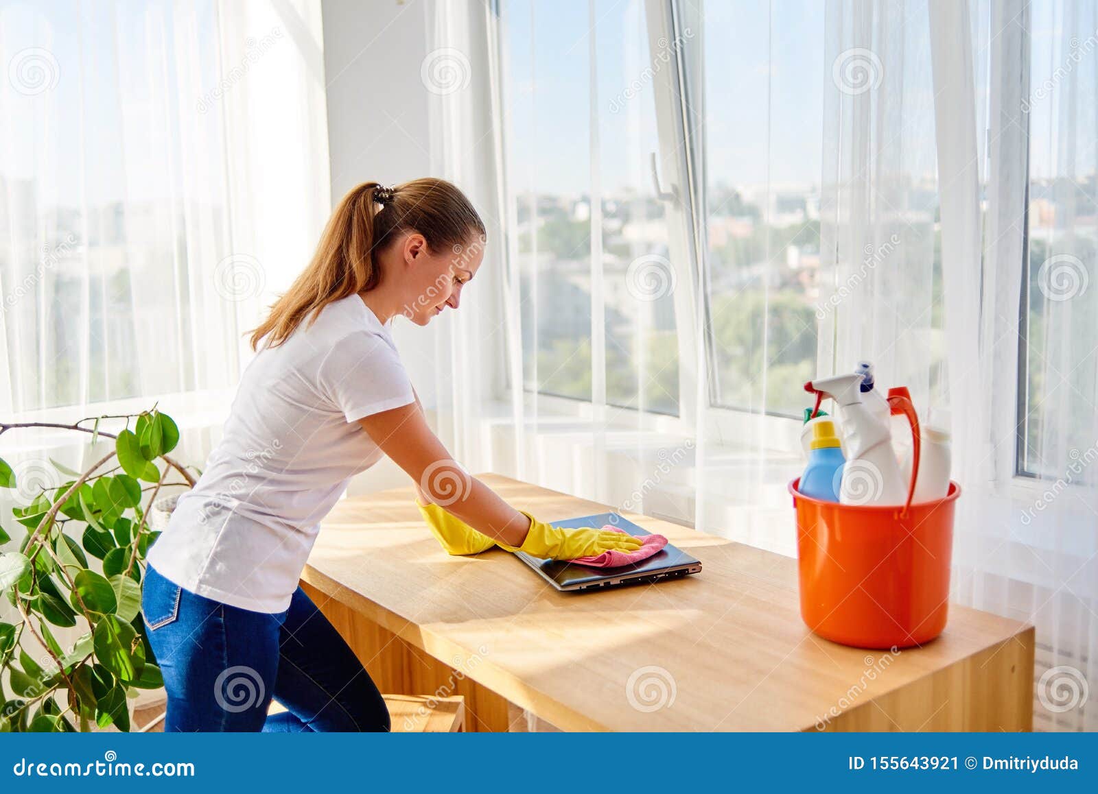 Woman in White Shirt and Yellow Protective Rubber Gloves Cleaning at Home  and Wiping Dust with Pink Rag on Laptop Computer. Stock Image - Image of  concept, dust: 155643921