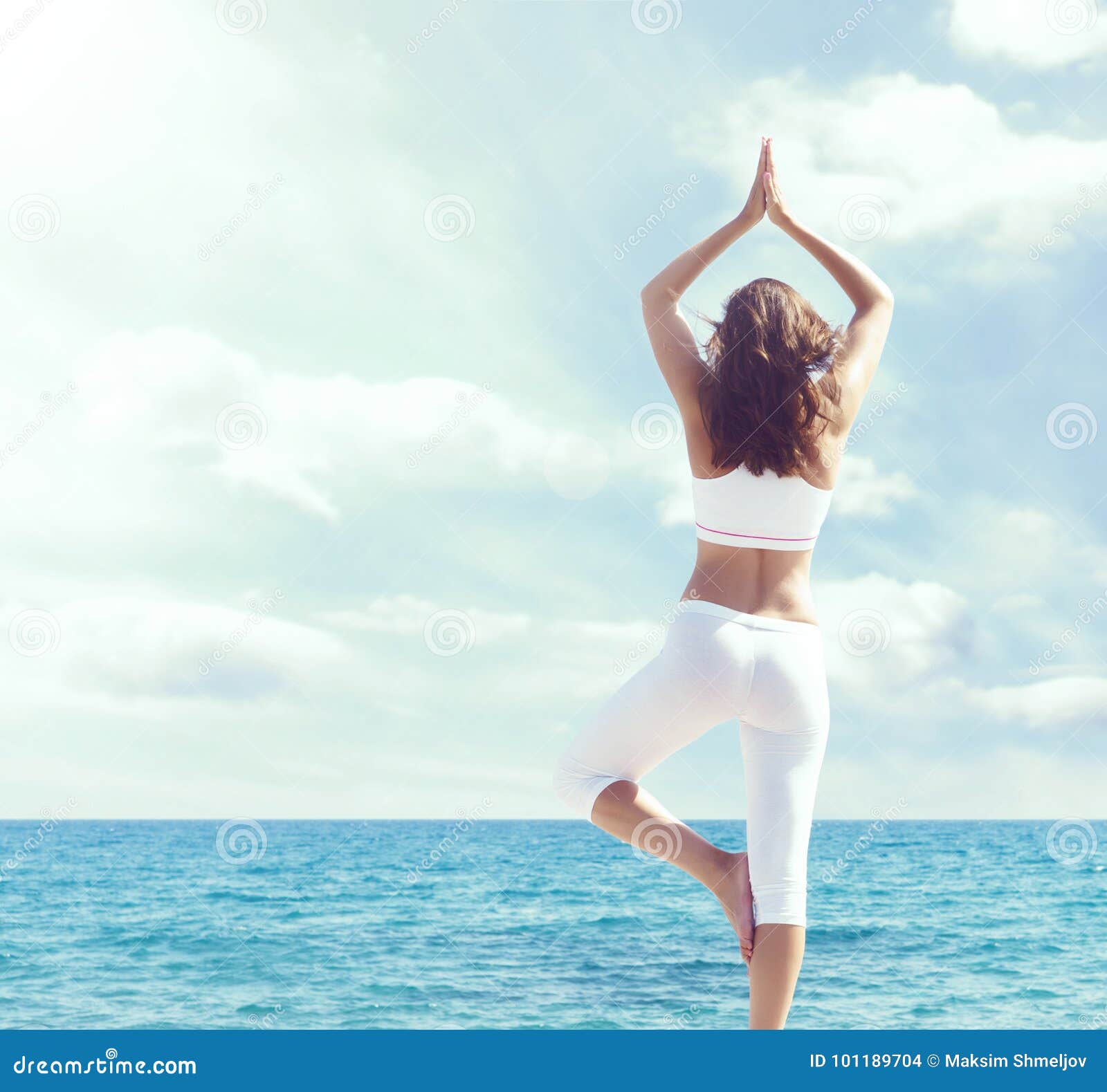 on 101189704 Stock - Image Doing of Wooden Yoga brunette, Photo care: White Woman Pier. and in Sportswear a Sea