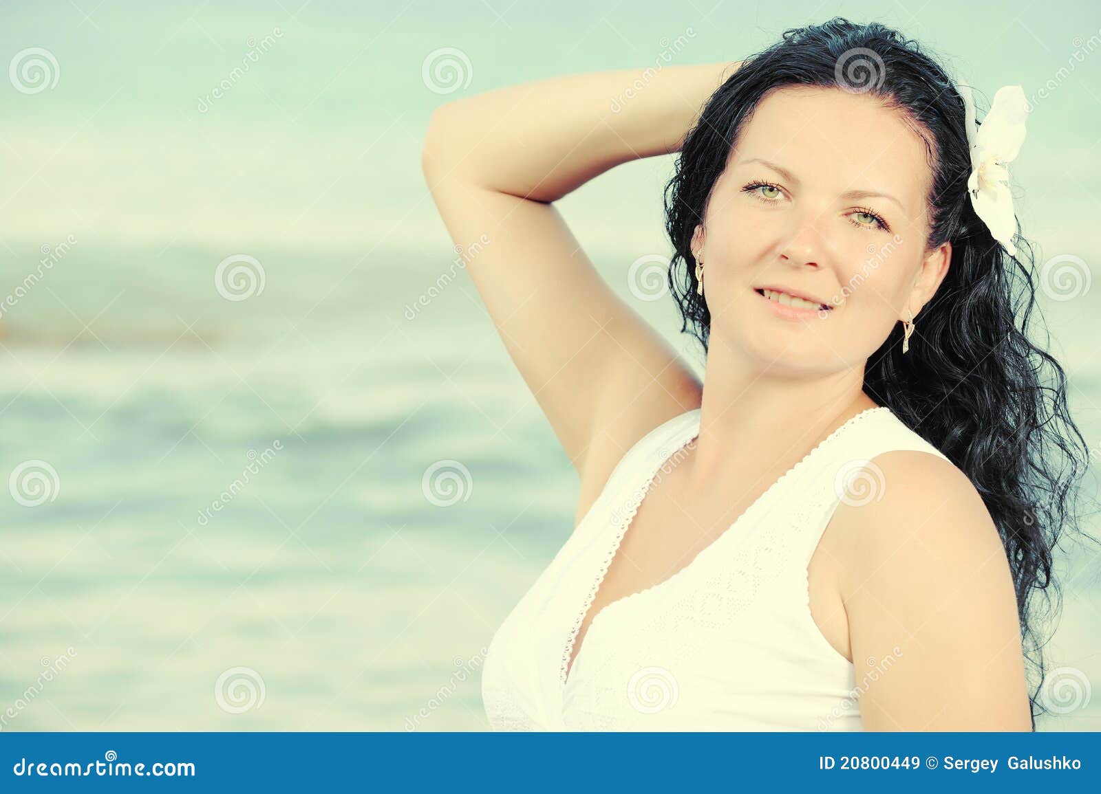 the woman in a white sundress on seacoast.