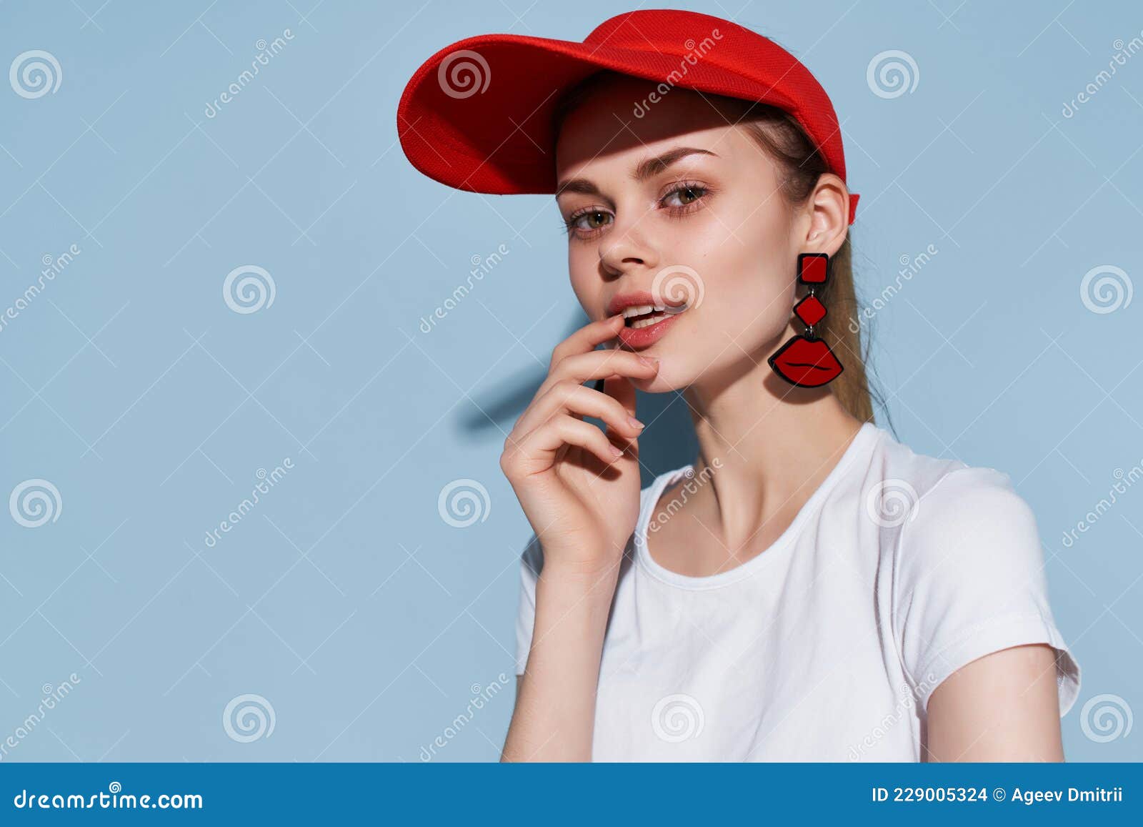 Woman in White T-shirt Red Cap Fashion Summer Style Posing Blue Background  Stock Photo - Image of caucasian, holding: 229005324
