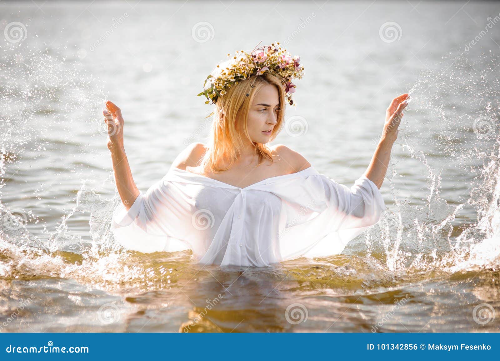 Woman in a White Wet Shirt and Floral Wreath Standing in Water Stock ...