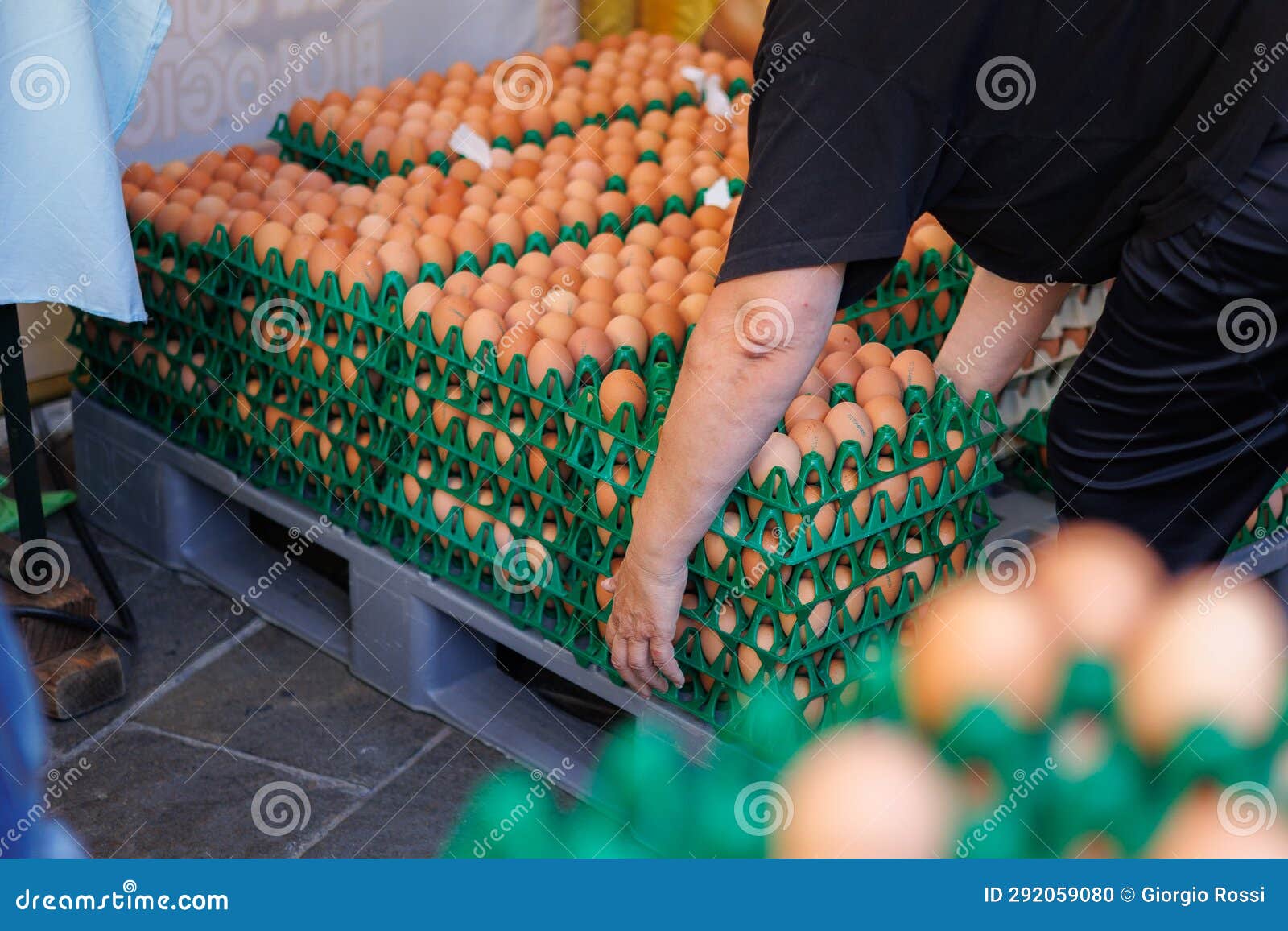 woman who proceeds to lift multiple egg packs