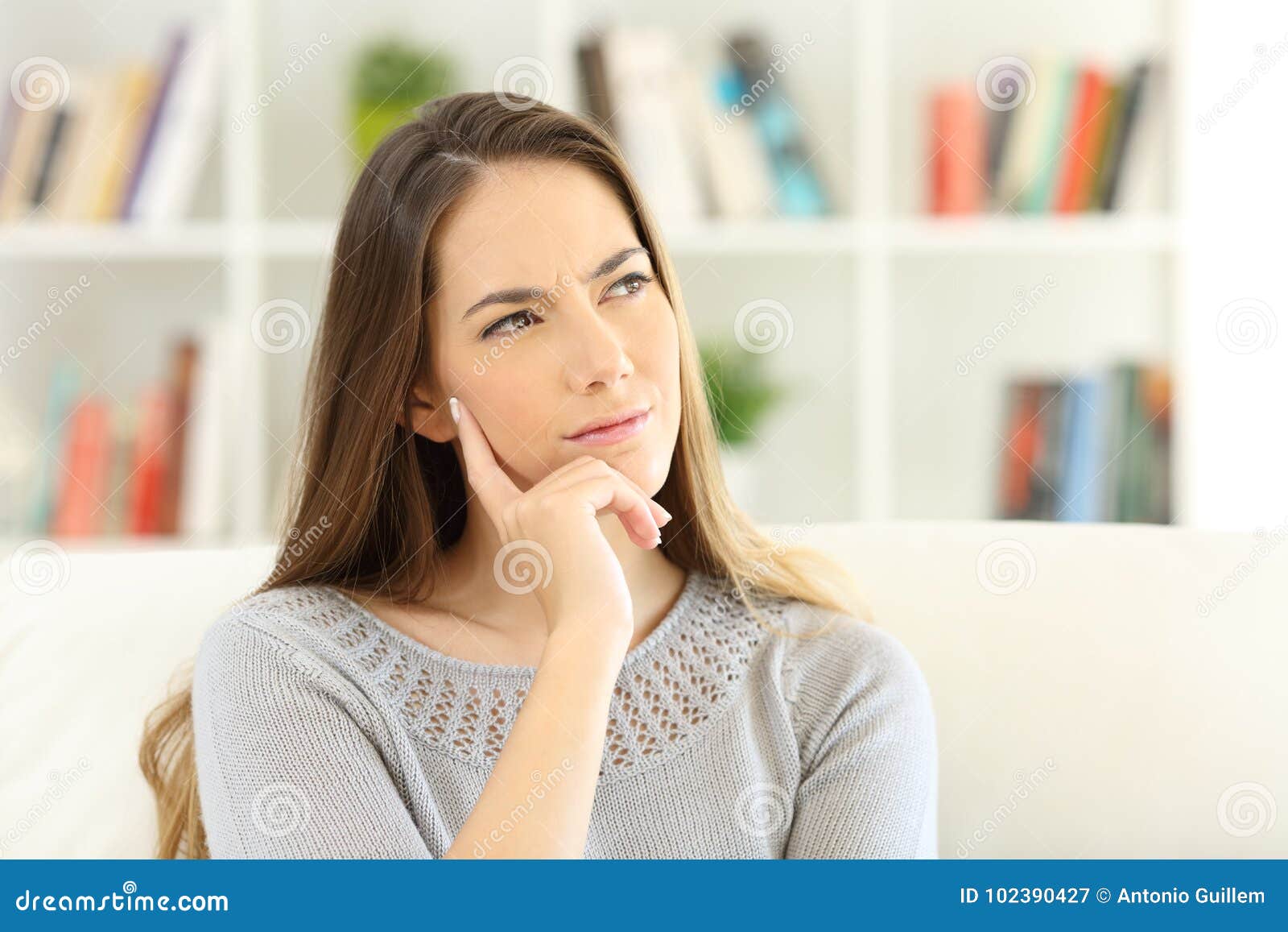 woman wondering sitting at home