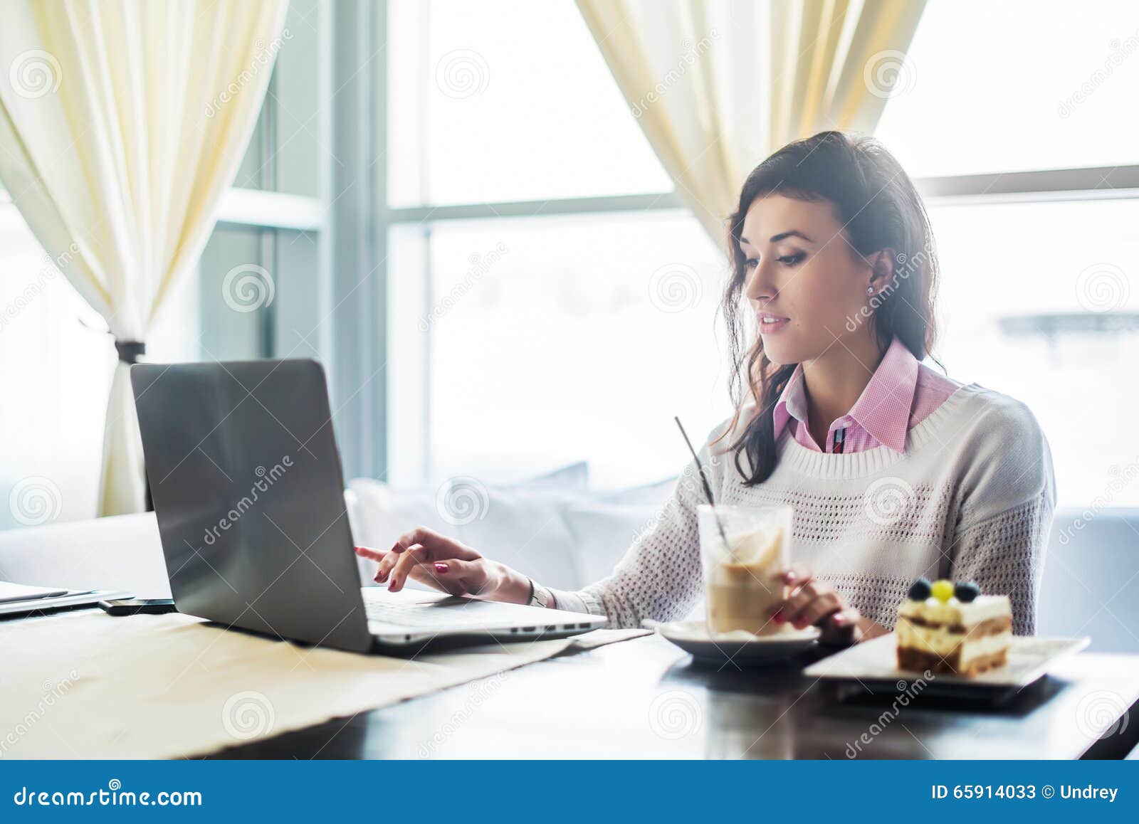 woman working on laptop notebook computer at cafe, internet distance work, business lunch.