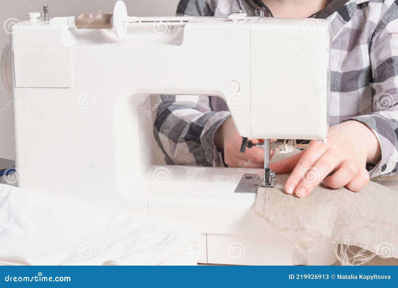 Woman Working with Sewing Machine, White Sewing Machine on the Table